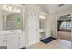 Bright bathroom with a double vanity, tile flooring, and a view to bedroom at 1120 Twin Bridge Ln, Peachtree City, GA 30269