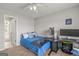 Comfortable bedroom with study desk and chair, plush carpet, and bright lighting at 1120 Twin Bridge Ln, Peachtree City, GA 30269