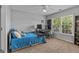 Cozy bedroom with a window view, study desk and chair, and a comfortable bed at 1120 Twin Bridge Ln, Peachtree City, GA 30269