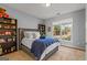 Cozy bedroom with a plush bed, natural light, and neutral tones at 1120 Twin Bridge Ln, Peachtree City, GA 30269