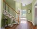 Elegant foyer with hardwood floors, staircase, and decorative details, creating a grand entry at 1120 Twin Bridge Ln, Peachtree City, GA 30269