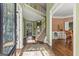 Inviting two-story foyer with hardwood floors, staircase, and views into adjoining living spaces at 1120 Twin Bridge Ln, Peachtree City, GA 30269