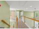 Hallway with wood flooring and stairs with a view of the living room at 1120 Twin Bridge Ln, Peachtree City, GA 30269