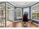 Bright home office featuring wood floors, a bay window, and french doors, creating an inviting workspace at 1120 Twin Bridge Ln, Peachtree City, GA 30269