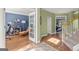 Bright home office featuring wood floors, a bay window, and french doors, creating an inviting workspace at 1120 Twin Bridge Ln, Peachtree City, GA 30269