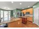 Well-equipped kitchen boasts granite countertops, an island, and stainless steel appliances at 1120 Twin Bridge Ln, Peachtree City, GA 30269