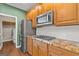 Updated kitchen with granite counters, stainless appliances, and ample cabinet space at 1120 Twin Bridge Ln, Peachtree City, GA 30269