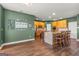 Spacious kitchen featuring wood floors, cabinets, stainless steel appliances, and an island at 1120 Twin Bridge Ln, Peachtree City, GA 30269
