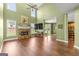 Bright living room boasting a stone fireplace, large windows, and hardwood flooring at 1120 Twin Bridge Ln, Peachtree City, GA 30269