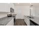 Bright kitchen with granite countertops, stainless steel appliances, and white cabinets at 620 Whitman Ln # 31, Stockbridge, GA 30281