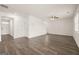 Large living room with hardwood floors, staircase, and multiple entryways at 620 Whitman Ln # 31, Stockbridge, GA 30281