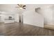Open living room flows into a modern kitchen with stainless appliances and hardwood floors at 620 Whitman Ln # 31, Stockbridge, GA 30281