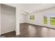 Spacious living room with hardwood floors, ceiling fan, and lots of natural light from the windows at 620 Whitman Ln # 31, Stockbridge, GA 30281