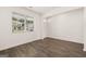Bright, airy living room with wood-style floors, neutral walls, and a large window at 620 Whitman Ln # 31, Stockbridge, GA 30281