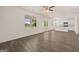 Open-concept living room with hardwood floors connecting to the kitchen at 620 Whitman Ln # 31, Stockbridge, GA 30281