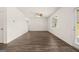 Bright living room with hardwood floors, ceiling fan, and a door to the backyard at 620 Whitman Ln # 31, Stockbridge, GA 30281