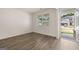 Bright, airy living room with wood-style floors, neutral walls, and a large window at 620 Whitman Ln # 31, Stockbridge, GA 30281