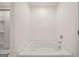 Large soaking tub in a modern bathroom with neutral walls at 620 Whitman Ln # 31, Stockbridge, GA 30281