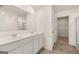 Bathroom with double sinks, tile floors, and walk-in shower at 620 Whitman Ln # 31, Stockbridge, GA 30281