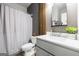 Clean bathroom with a gray vanity, shower with curtain, and modern decor at 150 Gadson Dr, Fayetteville, GA 30214