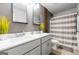 Bathroom with double vanity, striped shower curtain at 150 Gadson Dr, Fayetteville, GA 30214
