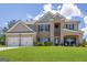 Beautiful two-story brick home with a well-manicured lawn and a spacious two-car garage at 150 Gadson Dr, Fayetteville, GA 30214