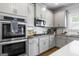 Modern kitchen features stainless steel appliances, granite countertops and subway tile backsplash at 150 Gadson Dr, Fayetteville, GA 30214