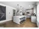 Bright kitchen featuring an island with barstool seating, modern appliances, and wood flooring at 150 Gadson Dr, Fayetteville, GA 30214