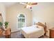 Bedroom with a ceiling fan, vaulted ceiling, and arched window at 3533 Saddlebrook Dr, Loganville, GA 30052