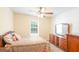 Bedroom featuring carpeted flooring, a ceiling fan, and a window for natural light at 3533 Saddlebrook Dr, Loganville, GA 30052