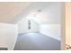 Spacious bonus room with light gray carpet, large window and white ceiling fan at 3533 Saddlebrook Dr, Loganville, GA 30052