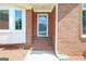 Close-up of the front entrance, showcasing the brick facade and glass-paneled door at 3533 Saddlebrook Dr, Loganville, GA 30052