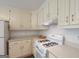 Well-lit kitchen features ample countertop space and white appliances at 3533 Saddlebrook Dr, Loganville, GA 30052