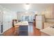 Bright kitchen featuring wood floors, center island, and ample cabinet space at 3533 Saddlebrook Dr, Loganville, GA 30052