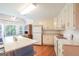 Bright kitchen features an island with a white countertop, white appliances, and plenty of cabinet space at 3533 Saddlebrook Dr, Loganville, GA 30052