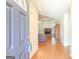 Inviting living room with hardwood floors, a brick fireplace, and a view towards the entrance at 3533 Saddlebrook Dr, Loganville, GA 30052