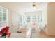 Bright sun room featuring tile floors, multiple windows, and wicker furniture at 3533 Saddlebrook Dr, Loganville, GA 30052