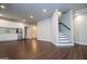 Finished basement with wood-look floors, kitchenette, and access to the upper levels at 137 River Birch Dr, Carrollton, GA 30116
