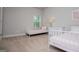 Bright bedroom featuring two twin beds, soft carpet, and a sunny window at 137 River Birch Dr, Carrollton, GA 30116