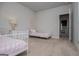 Cozy bedroom with twin beds, neutral walls, and access to an ensuite bathroom at 137 River Birch Dr, Carrollton, GA 30116
