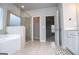 Bright bathroom showcasing a glass shower and separate tub with tile floors with closet entrance at 137 River Birch Dr, Carrollton, GA 30116