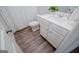Bathroom features a white vanity, toilet, and wood-look flooring at 137 River Birch Dr, Carrollton, GA 30116