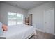 Neutral bedroom with white trim, large window, and a cozy atmosphere at 137 River Birch Dr, Carrollton, GA 30116