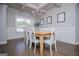 Bright dining room with a wooden table, white chairs, and a large window at 137 River Birch Dr, Carrollton, GA 30116