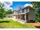 Inviting brick home featuring a well-manicured lawn and a charming covered front porch for relaxing and enjoying the outdoors at 137 River Birch Dr, Carrollton, GA 30116