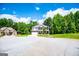 Charming two-story brick home with covered porch and well-manicured lawn at 137 River Birch Dr, Carrollton, GA 30116