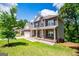 Charming two-story brick home with covered porch and well-manicured lawn at 137 River Birch Dr, Carrollton, GA 30116