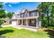 Charming two-story brick home with covered porch and well-manicured lawn at 137 River Birch Dr, Carrollton, GA 30116