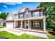 Charming two-story brick home with covered porch and well-manicured lawn at 137 River Birch Dr, Carrollton, GA 30116