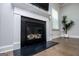 Modern fireplace with a white mantel and black accents at 137 River Birch Dr, Carrollton, GA 30116